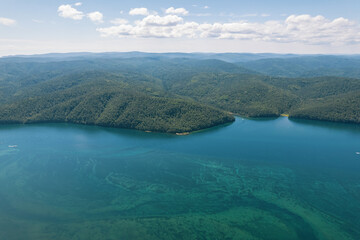 The Angara River is a major river in Siberia leaving Lake Baikal near the settlement of Listvyanka. Panoramic aerial view.