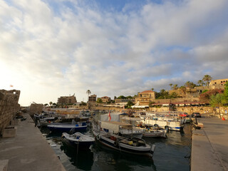Fototapeta na wymiar Beautiful city and port view. Old fishing boats