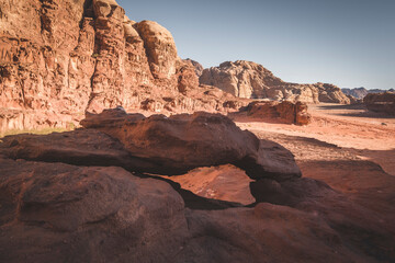 small arch in the dry and hot desert of Wadi Rum Jordan