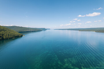 The Angara River is a major river in Siberia leaving Lake Baikal near the settlement of Listvyanka. Panoramic aerial view.