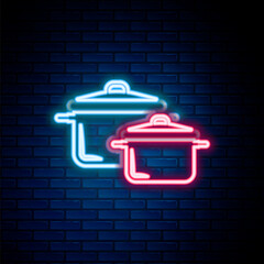 Glowing neon line Cooking pot icon isolated on brick wall background. Boil or stew food symbol. Colorful outline concept. Vector