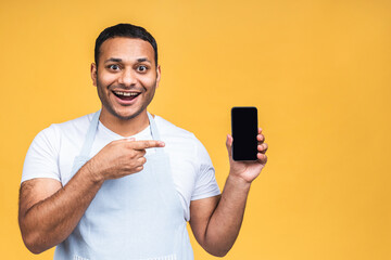 Black male african american indian cook or chef touching mobile phone display and pointing with...