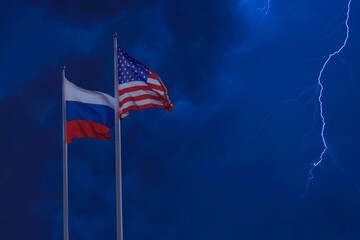 Sanctions and confrontation concept. Russian Federation and United States of America flags against night sky background with lightning