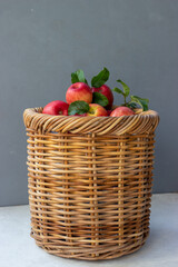 Red apples in a braided basket