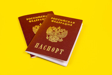Two passports of the Russian Federation. Passport on a yellow background.
