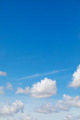 Naklejka na ściany i meble White clouds on the blue sky, background