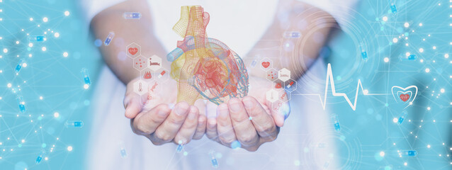 Woman hand holding digital holographic heart,with visual screen digital human heart and diagnostics analysis,concept futuristic cardiologist medical technology,hologram heartbeat,interface connection