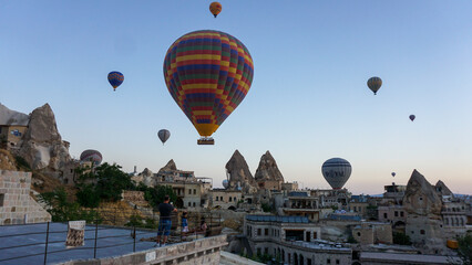 Hot air balloons launch in the Goreme national park in Cappadocia, Turkey. Colorful balon flying over. Cappadocia's greatest tourist attraction is ballooning.  © Motionic Studio