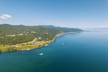 Fototapeta premium The Angara River in Siberia leaving Lake Baikal near the settlement of Listvyanka. Panoramic aerial view.