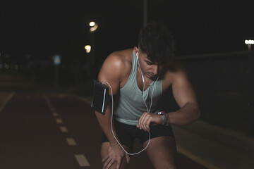Fototapeta na wymiar a young Moroccan athlete training at night on a public road.