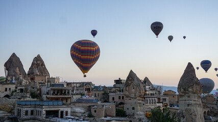 Hot air balloons launch in the Goreme national park in Cappadocia, Turkey. Colorful balon flying over. Cappadocia's greatest tourist attraction is ballooning.  © Motionic Studio