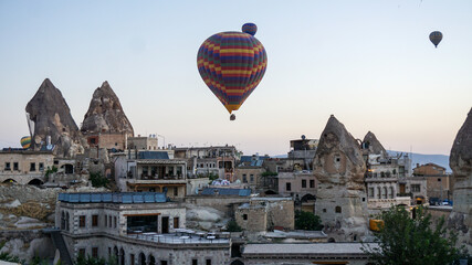 Hot air balloons launch in the Goreme national park in Cappadocia, Turkey. Colorful balon flying over. Cappadocia's greatest tourist attraction is ballooning.  © Motionic Studio