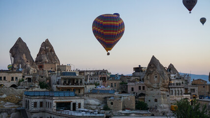 Hot air balloons launch in the Goreme national park in Cappadocia, Turkey. Colorful balon flying over. Cappadocia's greatest tourist attraction is ballooning.  © Motionic Studio