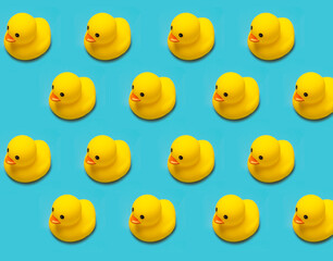 many toy rubber ducks isolated on blue background pattern, horizontal