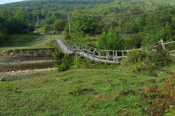 Wooden bridge over the river