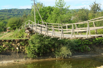 Wooden bridge over the river