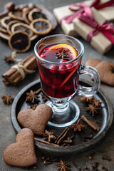 Christmas still life with glass of mulled wine, selective focus