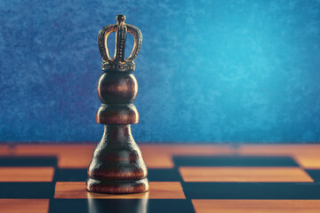 Pawn in crown on chess board against blue background with copy space. Personal Growth And...