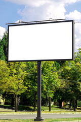 blank advertising billboard mockup. urban life. near park area. template for design. large advertising road banner