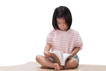 Obraz premium Asian child girl holding and reading textbook on wooden table. Learning never ends concepts. Isolated white background.