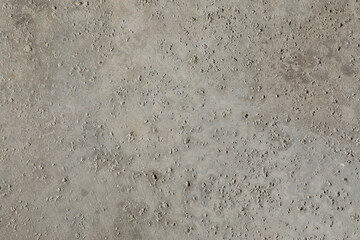 Rough gray cement surface in close-up detail