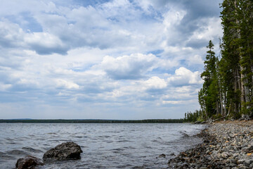 Stormy day on the shores of Lewis Lake, Wyoming, USA, as a nature background
