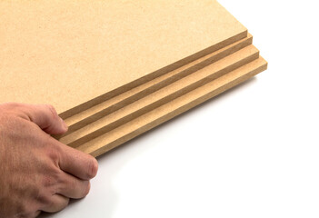 Brown-yellow Mdf boards ready for use in the furniture industry.