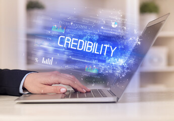 Closeup of businessman hands working on laptop