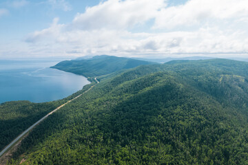 Summertime imagery of Lake Baikal is a rift lake located in southern Siberia, Russia Baikal lake summer landscape view from a cliff near Grandma's Bay. Drone's Eye View.