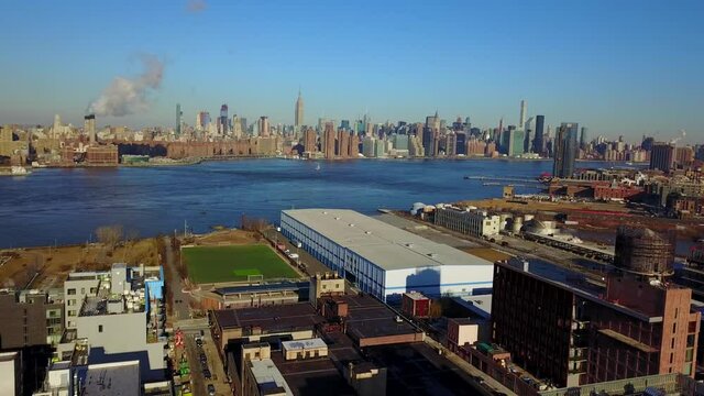 View of Midtown Manhattan and Williamsburg Brooklyn - Descending Crane Shot