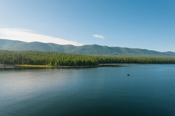 Fantastic panorama of Lake Baikal at sunset is a rift lake located in southern Siberia, Russia. Baikal lake summer landscape view. Drone's Eye View.