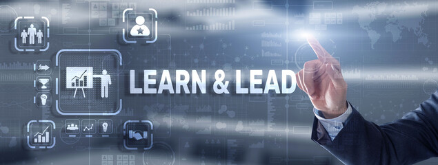 Learn and Lead. Businessman presses hand on the virtual screen inscription