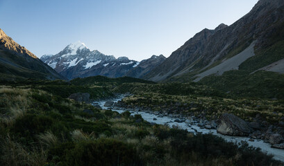 Naklejka na ściany i meble photo of mt cook in new zealand with a river in the foreground