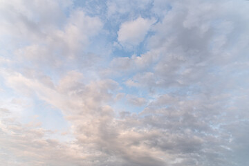 abstract background of white fluffy clouds on a bright blue sky