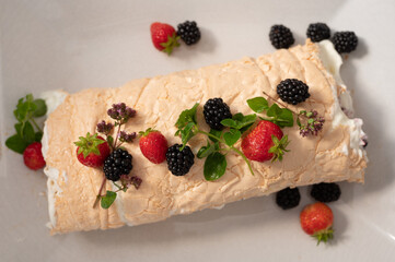 Meringue roll with seasonal berries