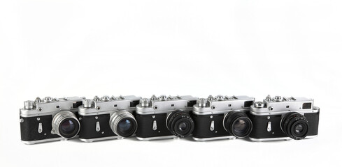 Old film photo rangefinder cameras on white background.