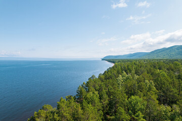 Summertime imagery of Lake Baikal is a rift lake located in southern Siberia, Russia Baikal lake summer landscape view from a cliff near Grandma's Bay. Drone's Eye View.