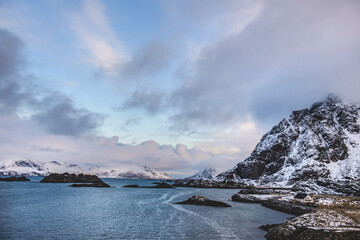 Mountain rural fishing village by the sea ocean winter snow houses