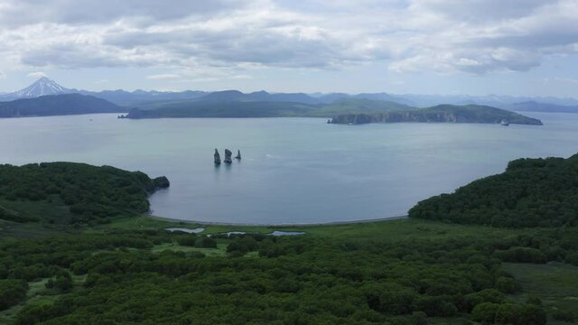Three Brothers is a famous landmark in the Avacha Bay. Kamchatka Peninsula, Russia