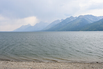 Stormy weather and wildfire smoke over Jackson Lake, Grand Teton National Park, USA
