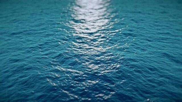 Flying over the blue surface of the sea or ocean. 4k seamless loop