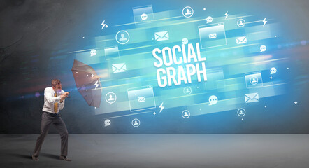 businessman defending with umbrella concept