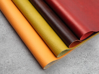 Natural leather textures samples on gray stone background
