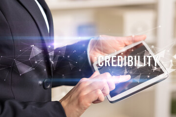 Close up hands using tablet