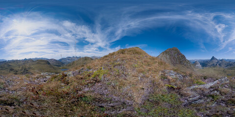 360 degree panoramic view of a mountain landscape with a cloudy sky. Pic des Moines