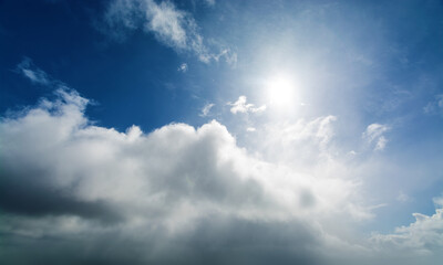 Grey stormy clouds covering the sky. After a while, the sun begins to shine through the clouds, and the sky is completely cleared in the end.