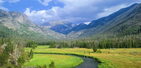 A mountain stream and green pastures