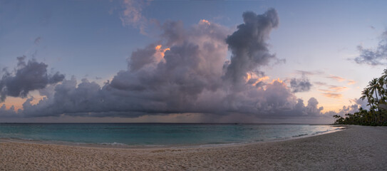 Panoramic picture of maldivian beach at sunset. Crossroads Maldives, saii lagoon and hard rock hotel. July 2021