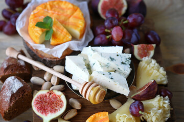 Cheese set with fruits and nuts. Delicious snacks. Keto set.