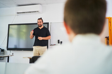 Spanish teacher giving lesson on a elementary class - obrazy, fototapety, plakaty